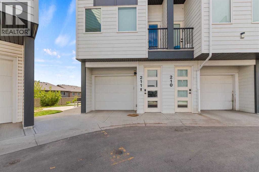 211, 101 Panatella Square Nw, Calgary, Alberta  T3K 2R9 - Photo 1 - A2313128