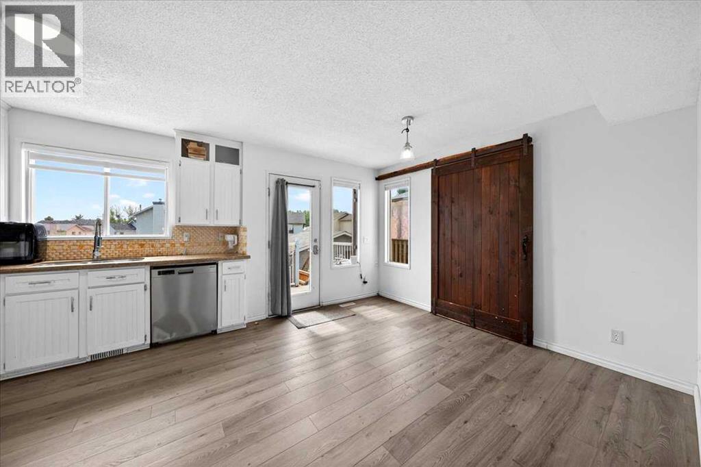 6979 Laguna Way Ne, Calgary, Alberta  T1Y 6W5 - Photo 11 - A2316513