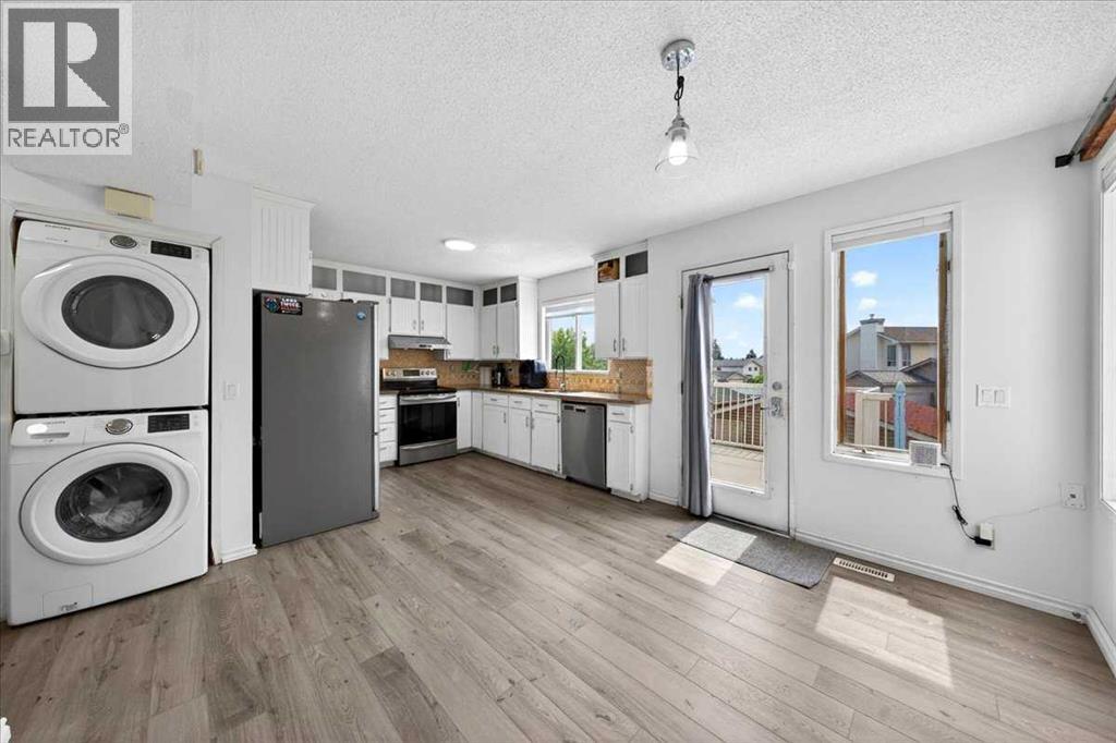 6979 Laguna Way Ne, Calgary, Alberta  T1Y 6W5 - Photo 12 - A2316513