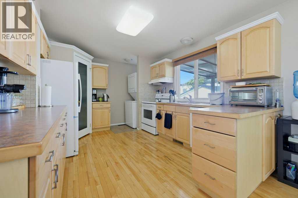 7115 Huntercrest Road Nw, Calgary, Alberta  T2K 4J9 - Photo 6 - A2317206