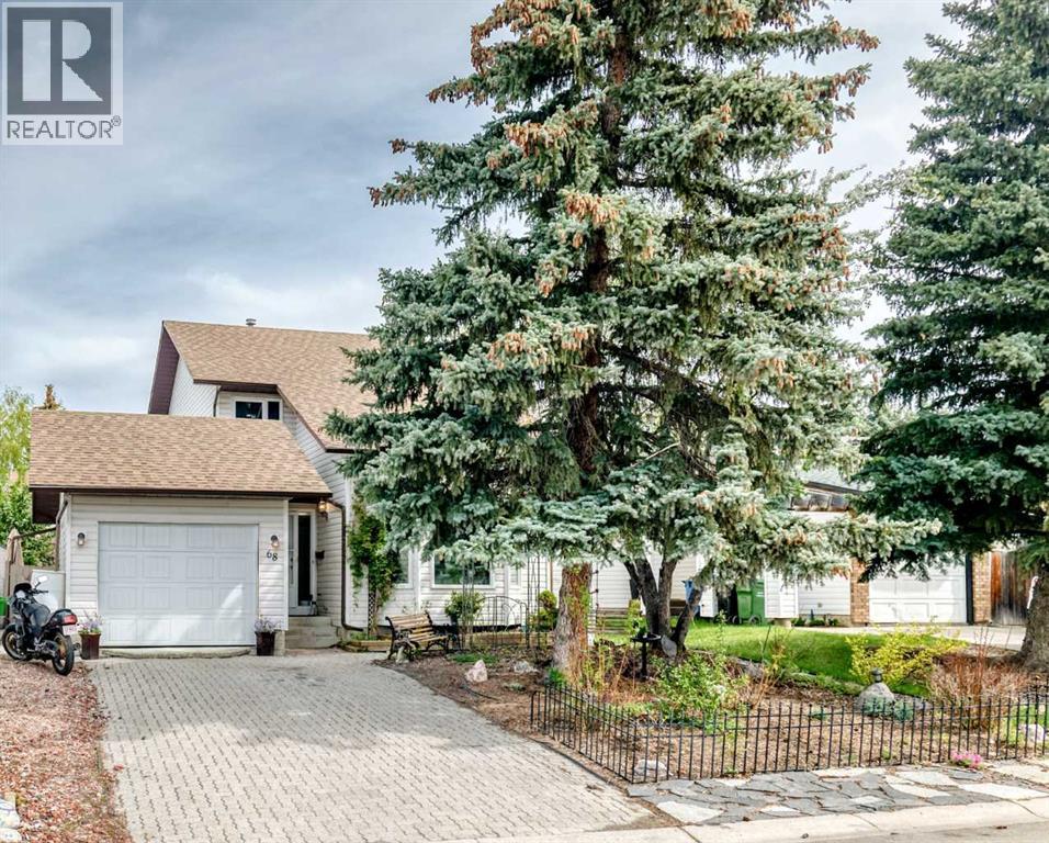 68 Woodview Court Sw, Calgary, Alberta  T2W 4X4 - Photo 1 - A2315916