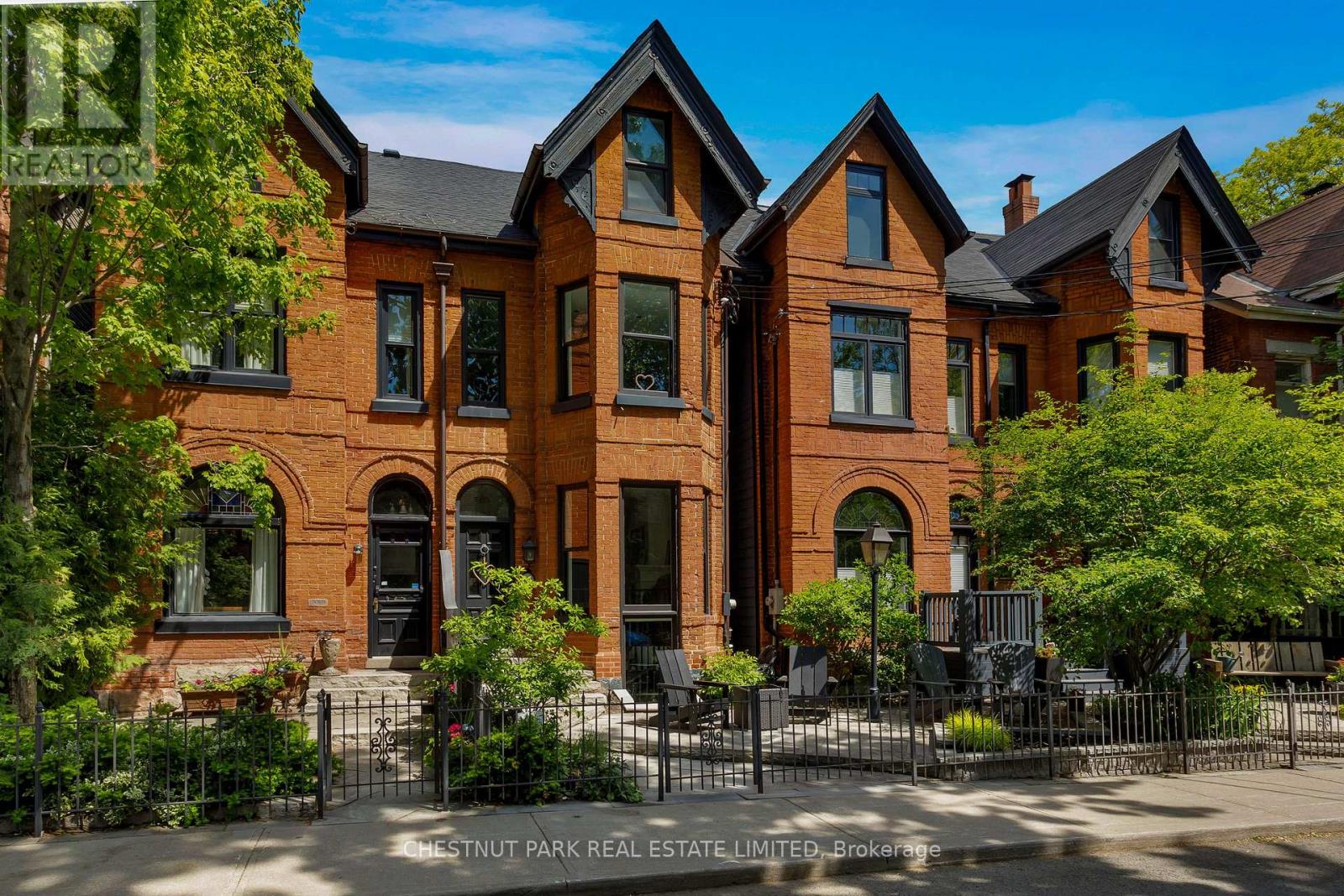 This architecturally stunning, fully renovated semi-detached Cabbagetown Victorian with rear addition is steps from Wellesley park and features a classic steep-pitched gabled roof, Indiana limestone front entrance stairs, copper eaves, and copper downspouts. Three sided, canted bay windows on each floor of the front south facade bathe the formal living room, second floor family room, and primary suite in natural light. The open concept main floor features a stunning cast iron spiral staircase visible from the street, an open concept formal living room and open dining room, a charming powder room, spectacular eat in kitchen, fully equipped with brand name stainless steel appliances, suits those well who are passionate about cooking and walks out to a comfortable patio. The second level features a large family room, which could be converted into a third bedroom, with a built in gable window seat, large office area with built-in cabinetry, a full washroom, laundry room, and a generous second bedroom with built in cabinetry and a private deck. The primary suite spans the full third floor bathed in natural light from a south facing window and skylight, features two walk in closets, and an impressive five piece ensuite with double sinks, a claw foot tub, and towel warmers. In-floor radiant heat and high velocity air conditioning throughout offer comfortable four seasons climate control. Steps to Wellesley park offers residence a sandy play area and splash pad for children, a pickle ball court, and lots of shaded grass area to enjoy. Take in the splendours of Cabbagetown including visiting Riverdale Farm, the seasonal Tuesday afternoon farmers markets, many great dining options, artesian vendors, corner store flower shops, everything you need and more in Toronto's largest Victorian neighbourhood. (id:48254)
