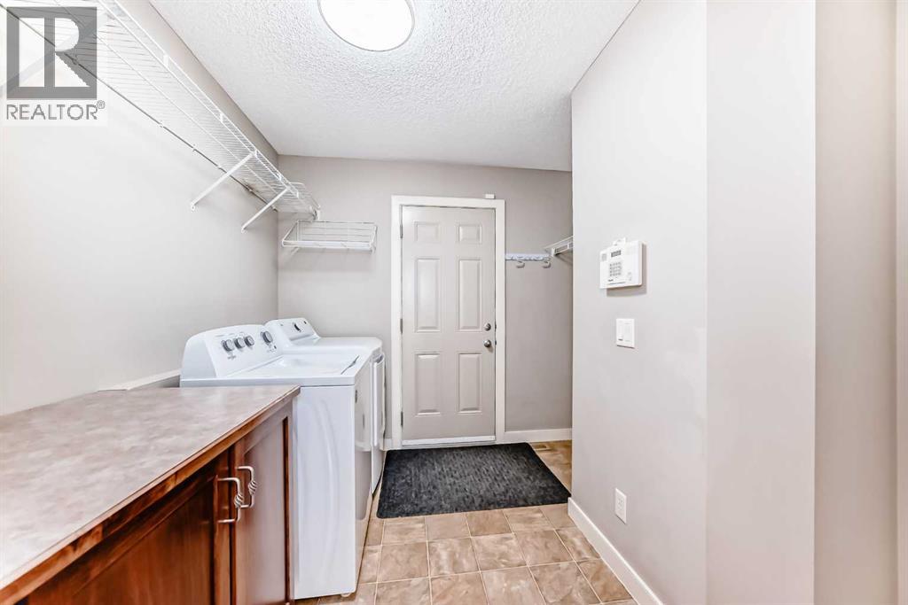 455 Hidden Creek Boulevard NW, Calgary, Alberta  T3K 0C1 - Photo 15 - A2311254