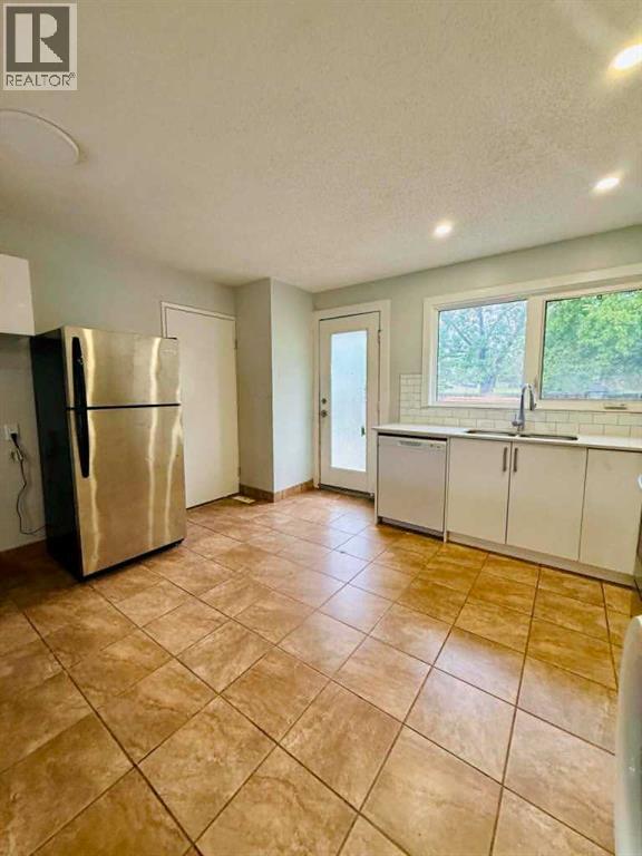 4968 Marcombe Road NE, Calgary, Alberta  T2A 4H2 - Photo 10 - A2318658