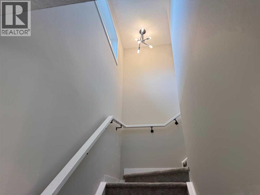 302 Sundown Road, Cochrane, Alberta  T4C 3H2 - Photo 22 - A2256036