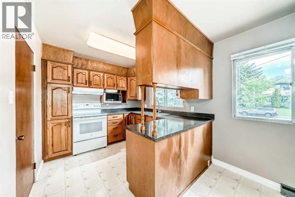 1228 Rosehill Drive NW, Calgary, Alberta  T2K 1M1 - Photo 4 - A2318980