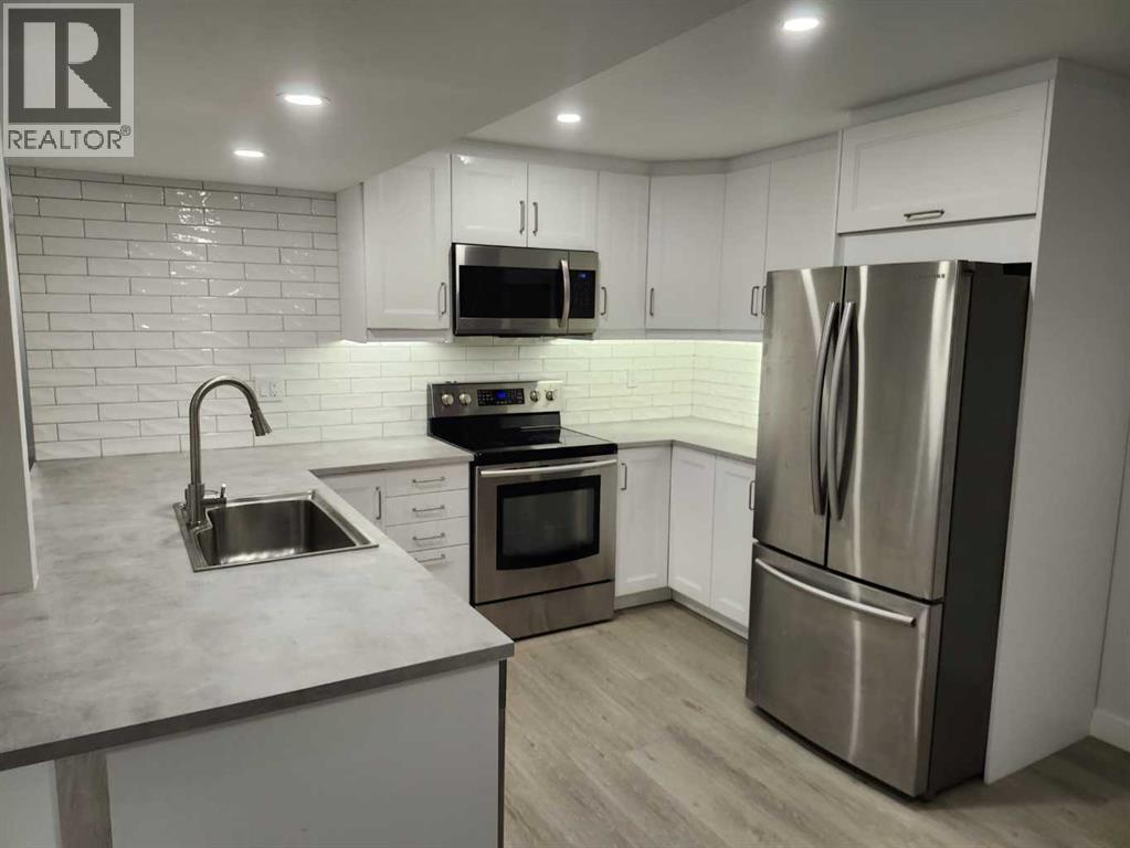 12108 Lake Waterton Way SE, Calgary, Alberta  T2J 2M4 - Photo 24 - A2318605