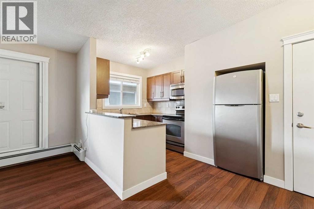 4, 605 67 Avenue SW, Calgary, Alberta  T2V 0M3 - Photo 1 - A2316843