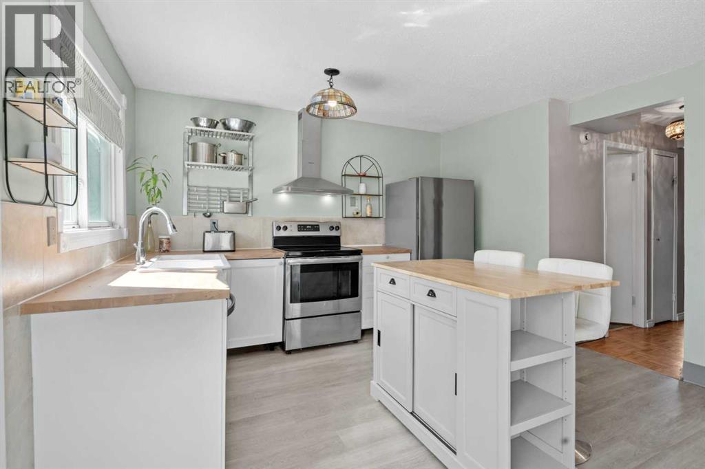 6646 Huntsbay Road NW, Calgary, Alberta  T2K 4R3 - Photo 8 - A2317856
