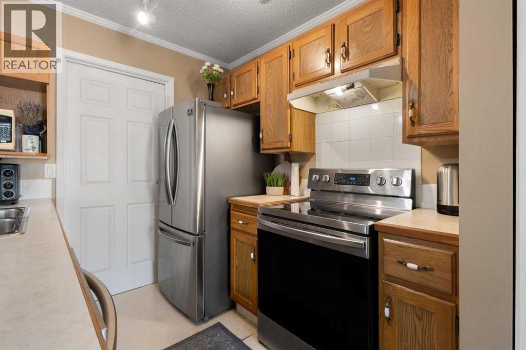 4, 203 Grier Terrace Ne, Calgary, Alberta  T2K 5Y7 - Photo 10 - A2319682
