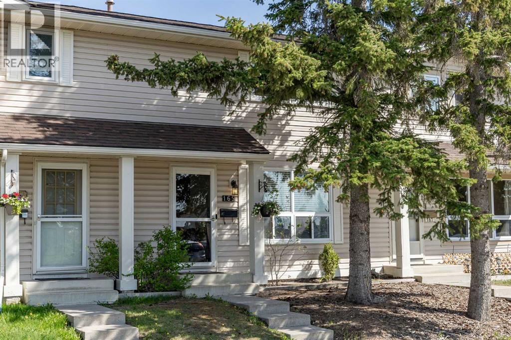 165 Woodmont Terrace SW, Calgary, Alberta  T2W 4Z4 - Photo 1 - A2314987