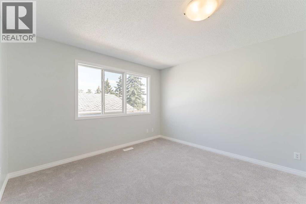6808 Rundlehorn Drive NE, Calgary, Alberta T1Y 3V2 - Photo 12 - A2301051