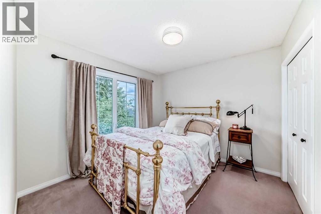 409 Rocky Ridge Bay Nw, Calgary, Alberta  T3G 4H8 - Photo 18 - A2319625