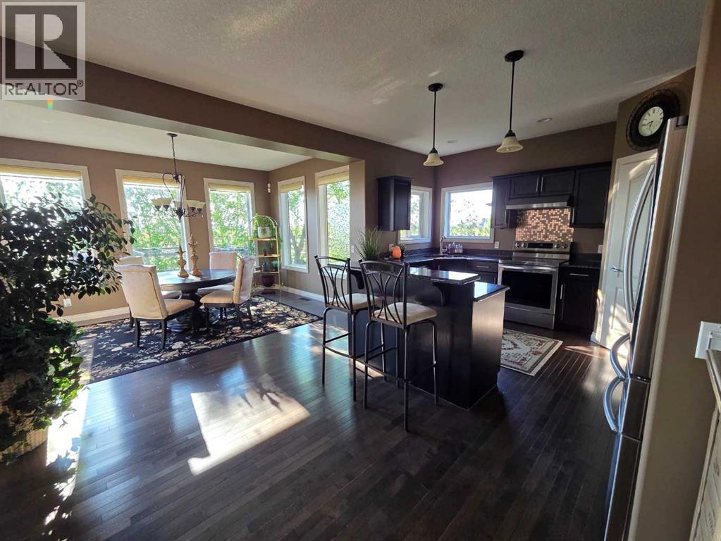 460 Sunset Link, Crossfield, Alberta  T0M 0S0 - Photo 4 - A2305740