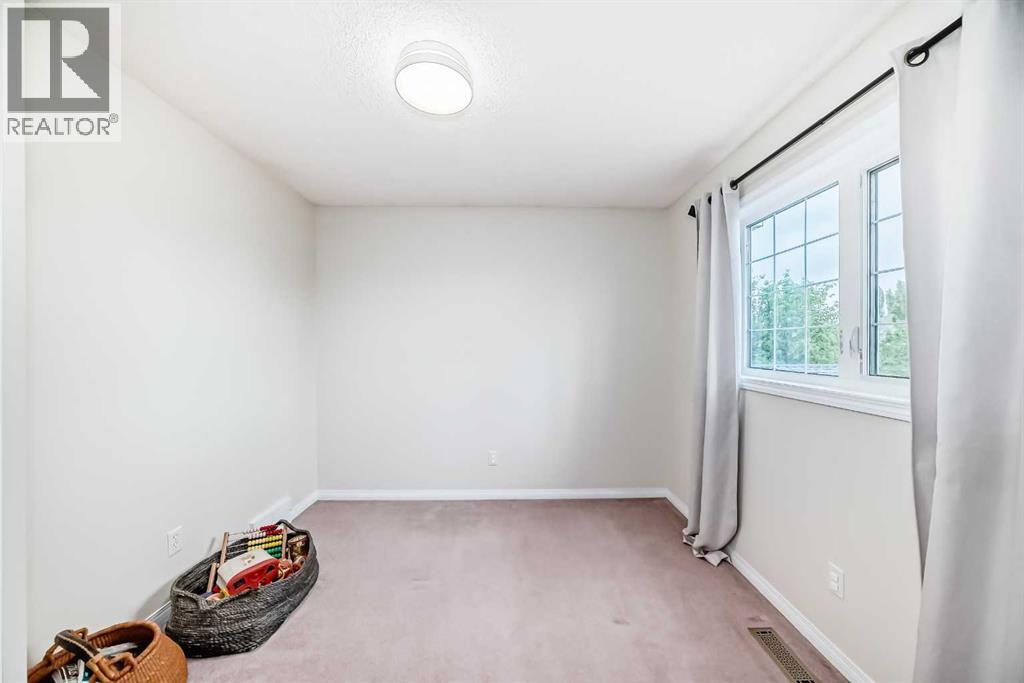 409 Rocky Ridge Bay NW, Calgary, Alberta  T3G 4H8 - Photo 17 - A2319625