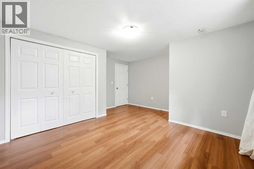 217 Woodvale Bay Sw, Calgary, Alberta  T2W 3L4 - Photo 32 - A2317749