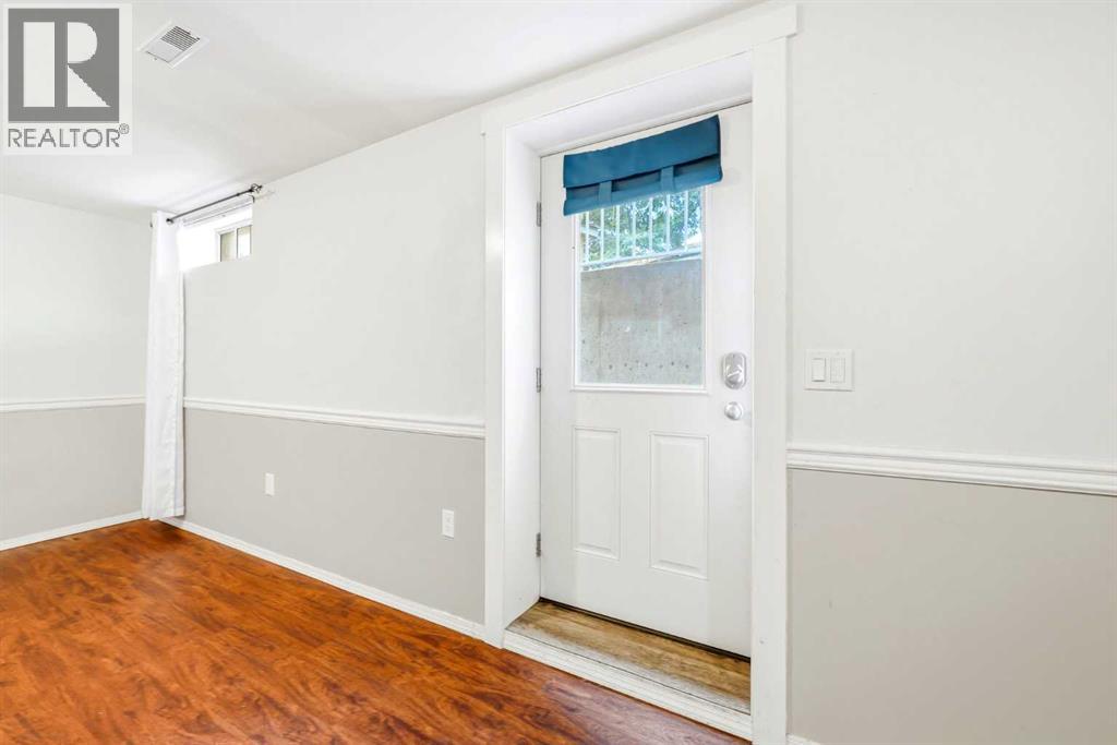 217 Woodvale Bay Sw, Calgary, Alberta  T2W 3L4 - Photo 22 - A2317749