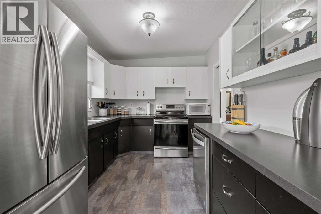 1141 Ninga Road NW, Calgary, Alberta  T2K 2P2 - Photo 11 - A2318600