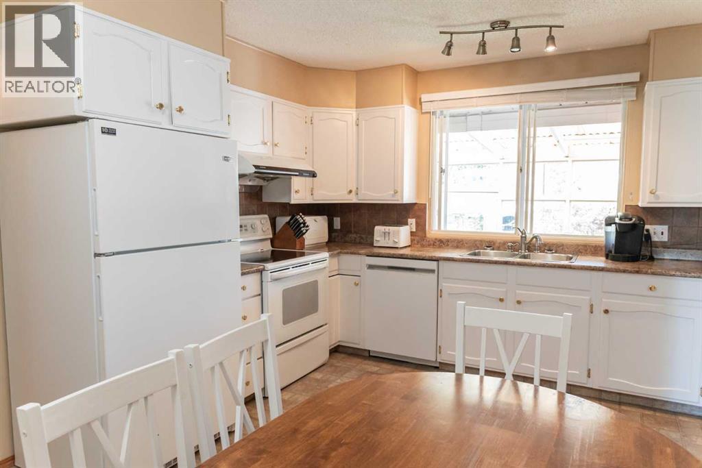 164 Huntford Road Ne, Calgary, Alberta  T2K 3Y9 - Photo 10 - A2317475