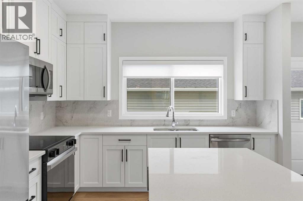 2253 Bayview Drive Sw, Airdrie, Alberta  T4B 5N3 - Photo 7 - A2320939