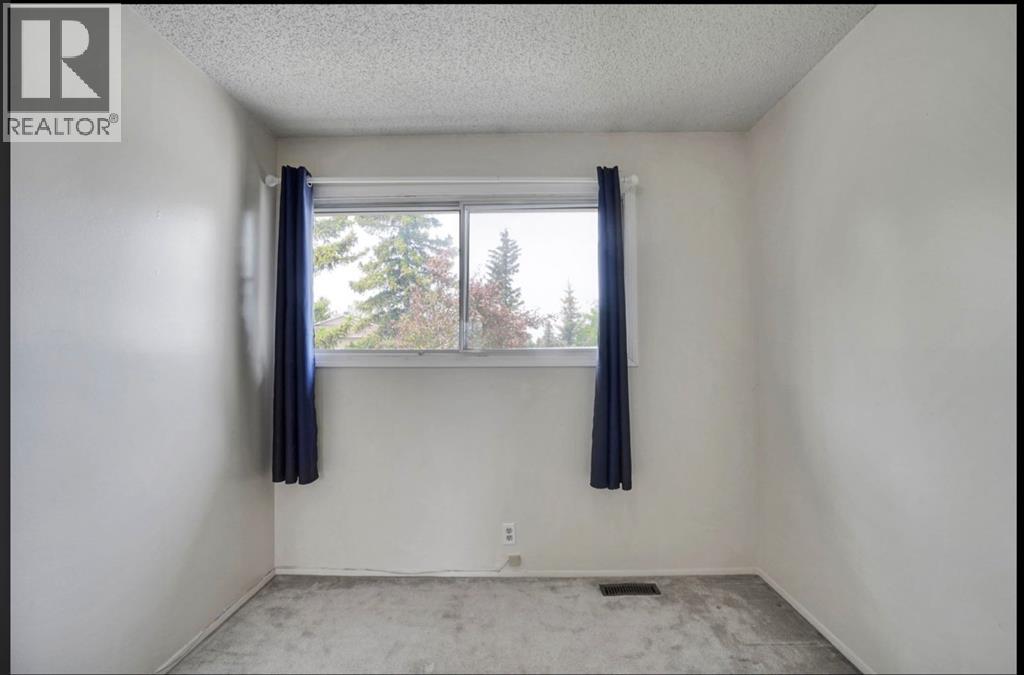 164 Woodsman Lane, Calgary, Alberta  T2W 4Z6 - Photo 16 - A2321633