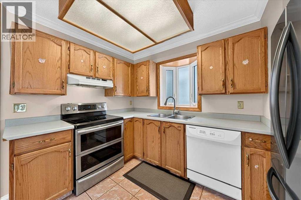 136 Hunterhorn Drive, Calgary, Alberta  T2K 6H3 - Photo 11 - A2322435