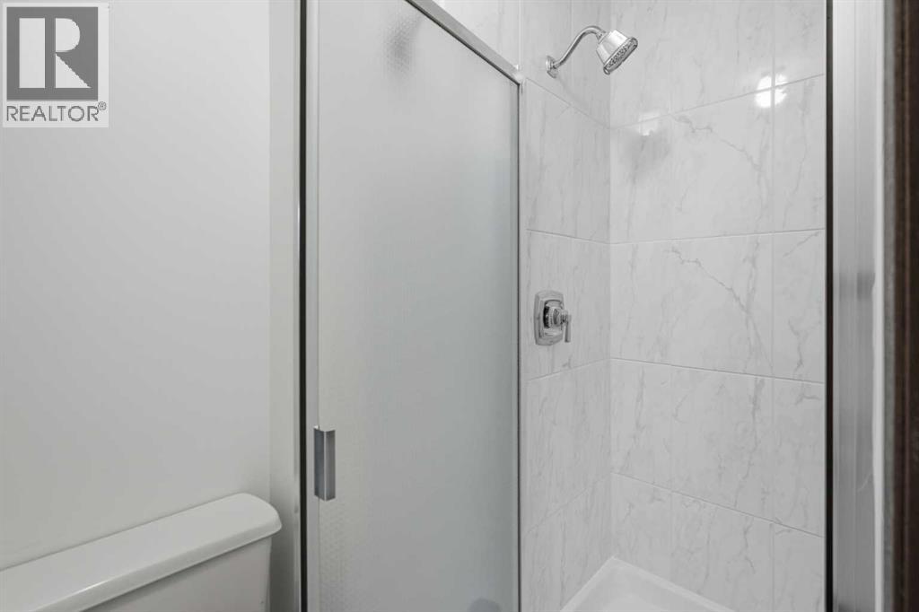 27 Woodgreen Place Sw, Calgary, Alberta  T2W 4A3 - Photo 19 - A2321722
