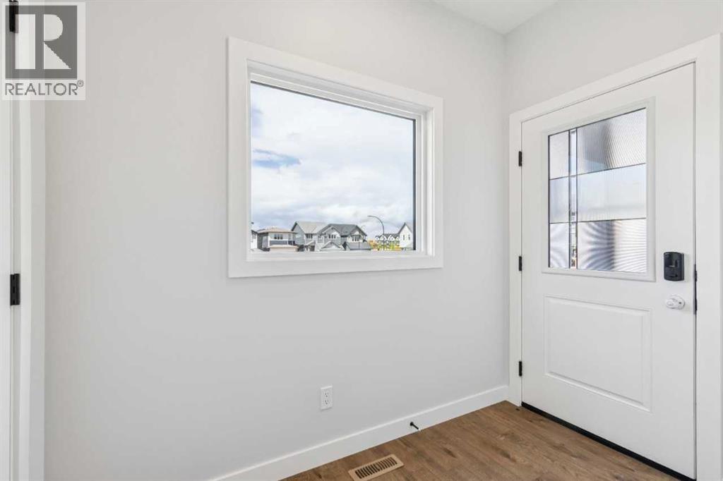 35 Creekside Rise SW, Calgary, Alberta T2X 5V9 - Photo 3 - A2322503