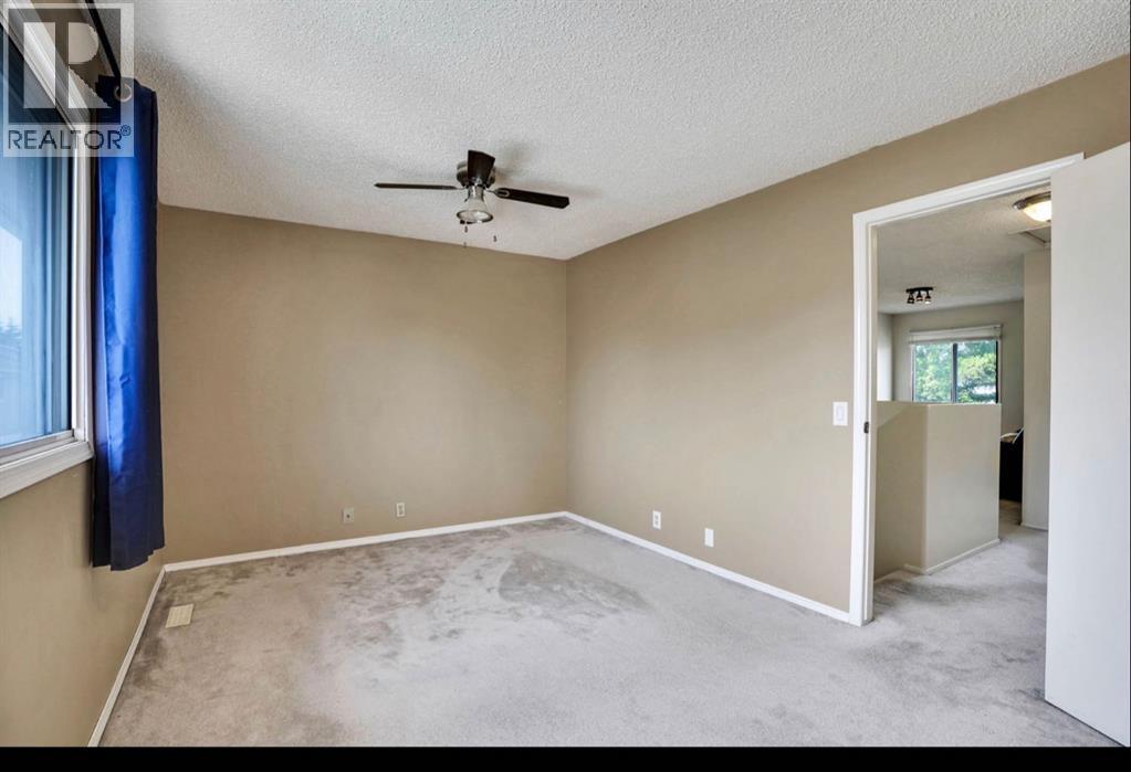 164 Woodsman Lane, Calgary, Alberta  T2W 4Z6 - Photo 14 - A2321633