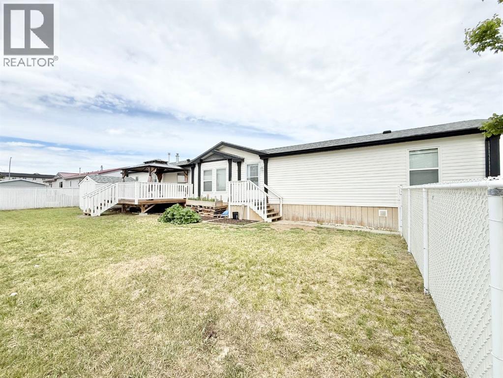 56 Meadowplace Crescent E, Brooks, Alberta  T1R 0R5 - Photo 1 - A2316445