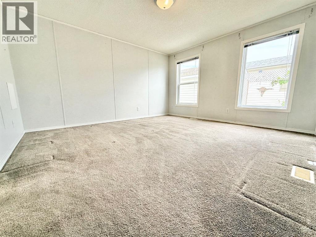 56 Meadowplace Crescent E, Brooks, Alberta  T1R 0R5 - Photo 24 - A2316445