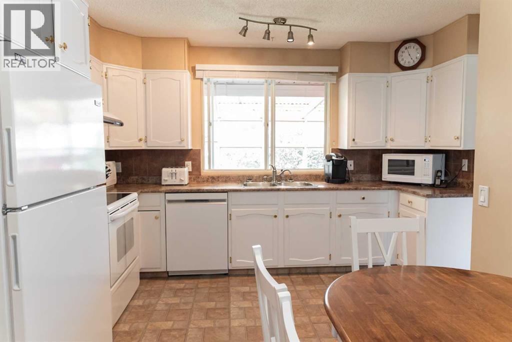 164 Huntford Road NE, Calgary, Alberta  T2K 3Y9 - Photo 9 - A2317475