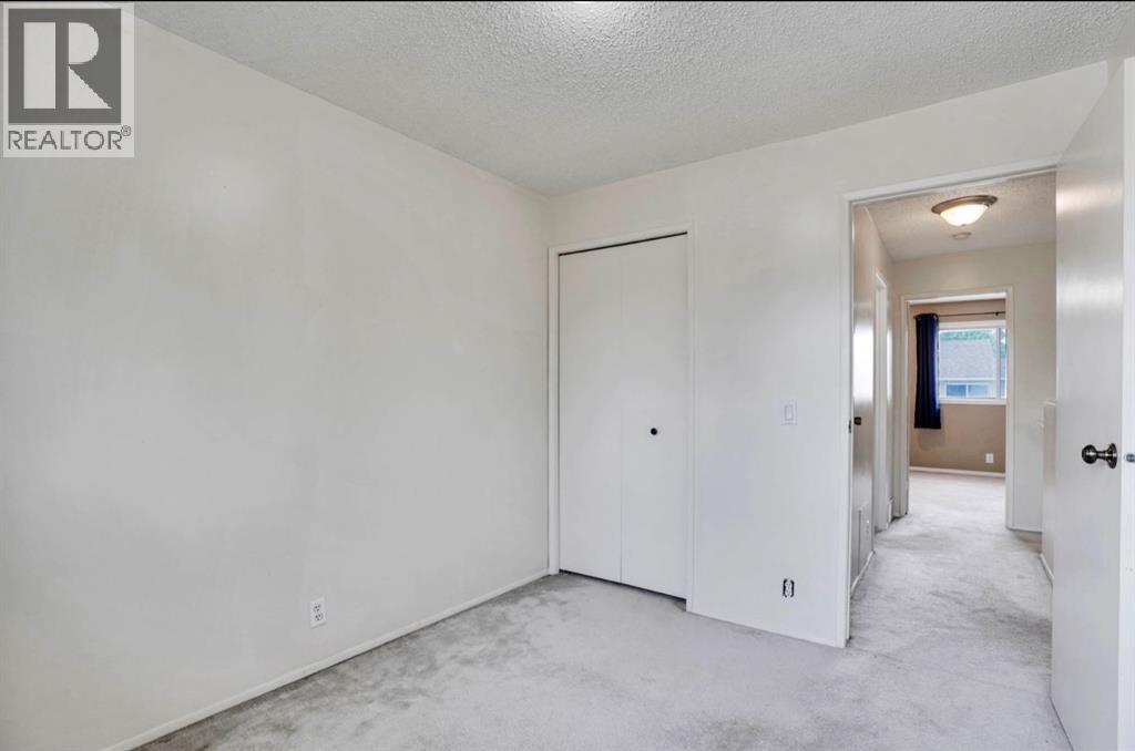 164 Woodsman Lane, Calgary, Alberta T2W 4Z6 - Photo 17 - A2321633