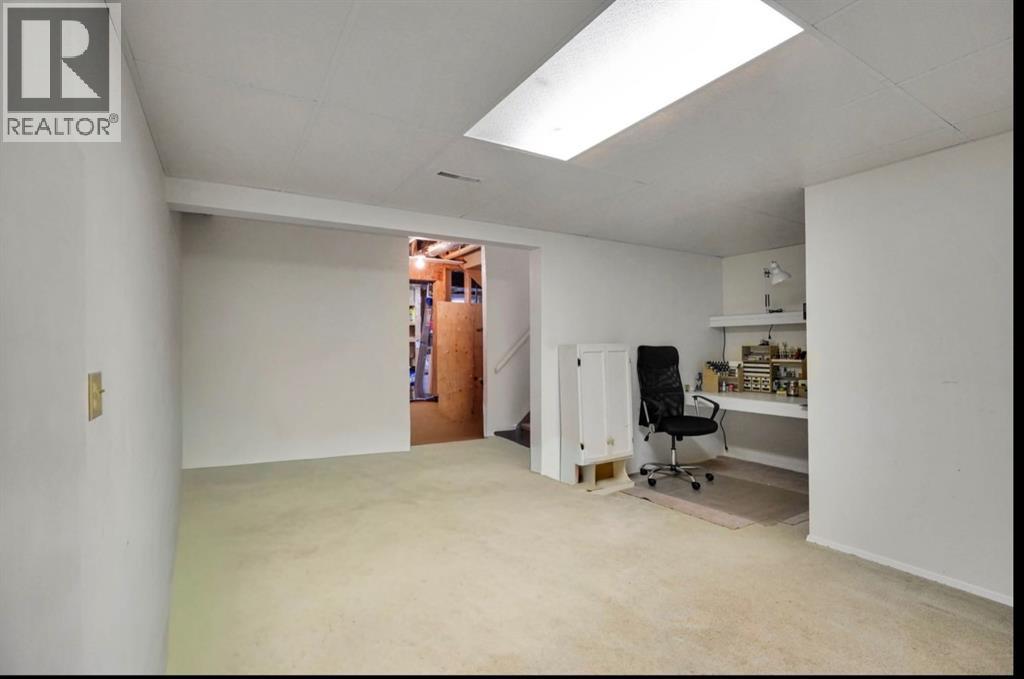 164 Woodsman Lane, Calgary, Alberta T2W 4Z6 - Photo 21 - A2321633