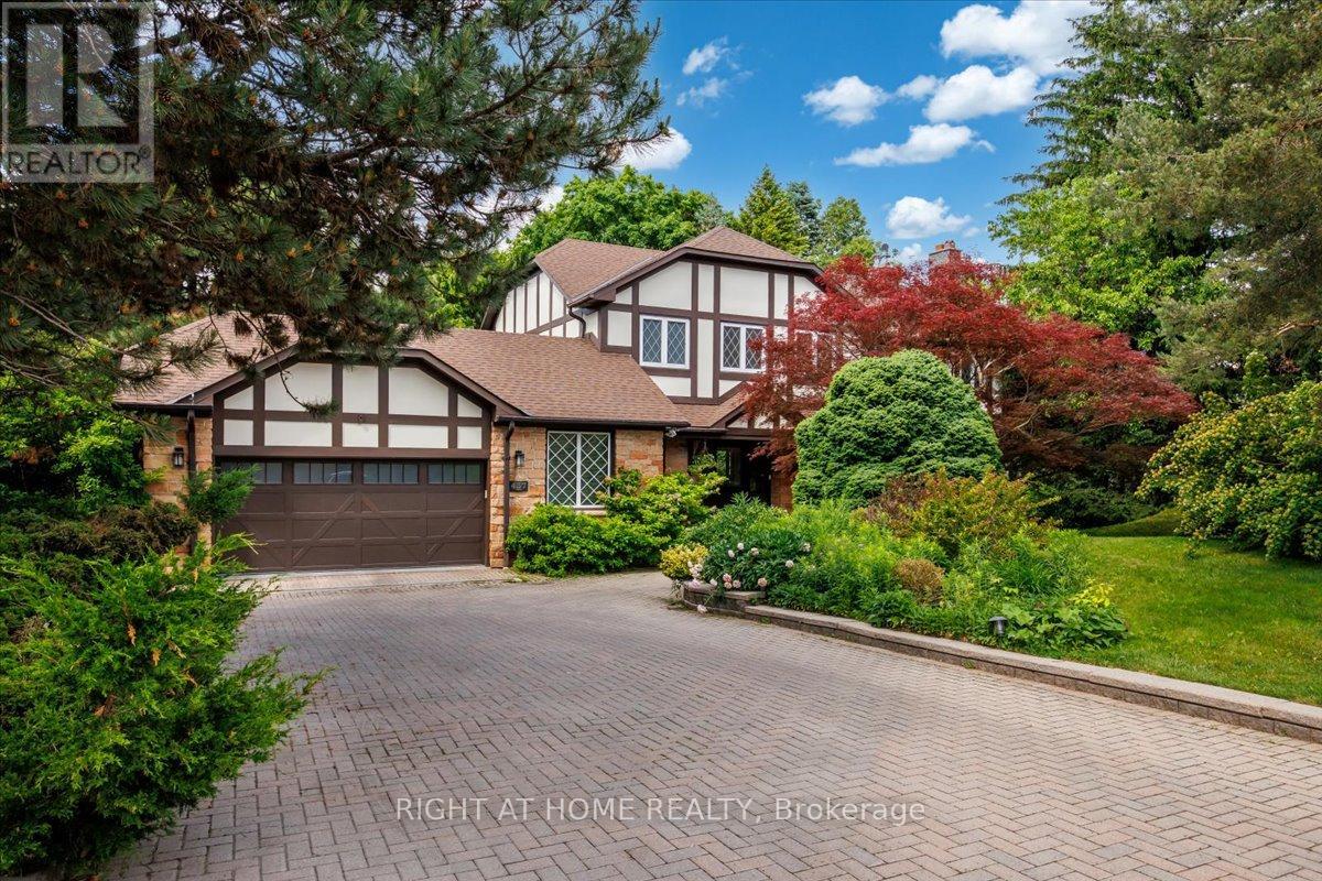 Backing onto the 8th hole of St. George's Golf & Country Club, 437 The Kingsway is a heritage Tudor-style residence set well back from the street on a 234 x 146 ft rare estate-sized irregular lot beneath a mature canopy of trees in the heart of The Kingsway. Formerly the residence of the Swiss Consul General for over three decades, this notable property offers a rare combination of privacy, provenance and approximately 5,424 sq ft of finished living space.Surrounded by mature landscaping for exceptional privacy, the home is thoughtfully oriented to capture views of the gardens, tree canopy and golf course beyond. A renovated mid-century modern interior, European tilt-and-turn windows and doors, and seamless indoor-outdoor connections create a home that feels both sophisticated and welcoming. A gracious foyer and beautifully proportioned principal rooms enhance the home's scale and flow.The chef-inspired kitchen features premium JennAir appliances, generous prep and storage space, and flows into the breakfast area and family room overlooking the private rear gardens and golf course setting.The finished walkout lower level with cellar offers exceptional flexibility for recreation, guests, a home office, gym or multigenerational living.Upstairs, four generous bedrooms and updated bathrooms provide comfortable family living, including a spacious primary suite overlooking the grounds. An adjoining sitting room offers flexibility as a lounge, nursery, office or fifth bedroom. Additional features include multiple wood fireplaces, imported enhanced-security European windows and doors, mature landscaped grounds, direct garage access and driveway parking for 6 to 8 vehicles. Located near Humber Valley Village JMSS, Kingsway College School, Humbertown Shopping Centre, Humber River trails, parks, golf, transit and convenient access to Pearson Airport, approximately 10 minutes away. A property of this scale, setting and provenance rarely becomes available in The Kingsway. (id:48254)