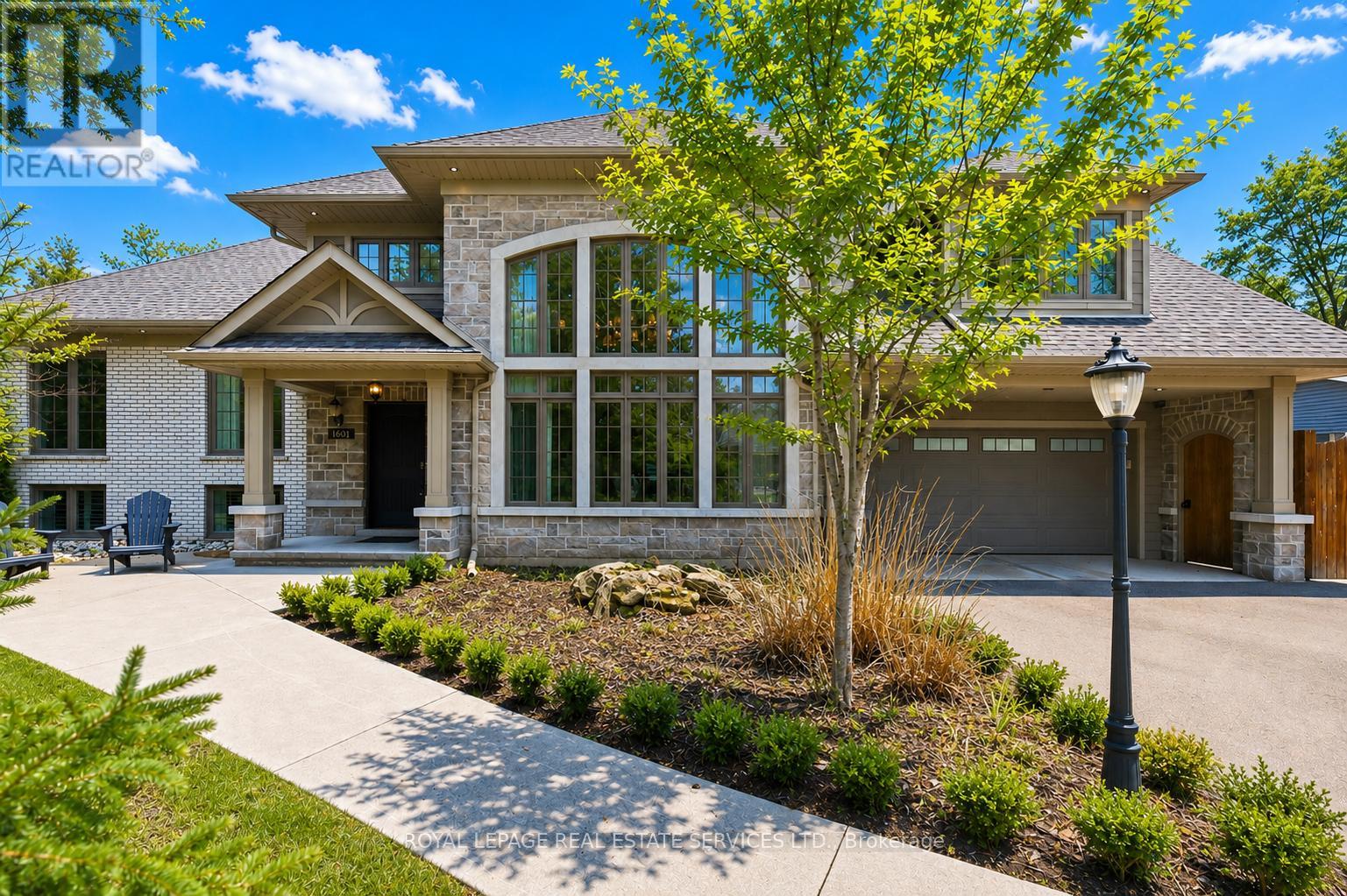 REIMAGINED CUSTOM RESIDENCE IN PRESTIGIOUS CORONATION PARK! Situated on a premium 90' x 125' mature lot in one of S/W Oakville's most sought-after neighbourhoods, this exceptional family home offers over 4,500 SF of finished living space. Featuring 6 bedrooms and 4.5 bathrooms, this residence combines refined finishes, spacious principal rooms, and a highly functional layout. A dramatic double-height living room with a soaring 17' ceiling, architectural windows, gas fireplace, and automated drapery creates an impressive focal point. The gourmet kitchen is equipped with quartz countertops, peninsula seating, a farmhouse sink, prep island with sink, and a 36" Thermador gas range, opening to the dining area with walkout to a composite deck with glass panels. The upper levels offer exceptional privacy and flexibility. The second level features two spacious bedrooms, including one with a four-piece ensuite, powder room, and a vaulted-ceiling lounge. Occupying its own level, the primary retreat boasts dual walk-in closets, including a laundry rough-in, and a spa-inspired five-piece ensuite with a freestanding tub, oversized glass shower, and heated floor. Two additional bedrooms and a five-piece bathroom complete this level. The finished lower level includes a media room with built-in shelving, plus a sixth bedroom/office. The basement offers a recreation area with walkout access, gym, full bath, laundry room, extensive built-in storage, and direct garage access. Additional highlights include engineered hardwood flooring, dual HVAC systems, Ecobee smart thermostats, exterior soffit lighting, and parking for six vehicles. The private backyard is designed for entertaining, featuring a saltwater pool, outdoor wet bar, pergola, and multiple seating areas. Within walking distance of Coronation Park, the lake, and top-ranked schools. Rarely does a home of this calibre become available in such a coveted location. (certain images have been digitally enhanced and virtually staged (id:48254)