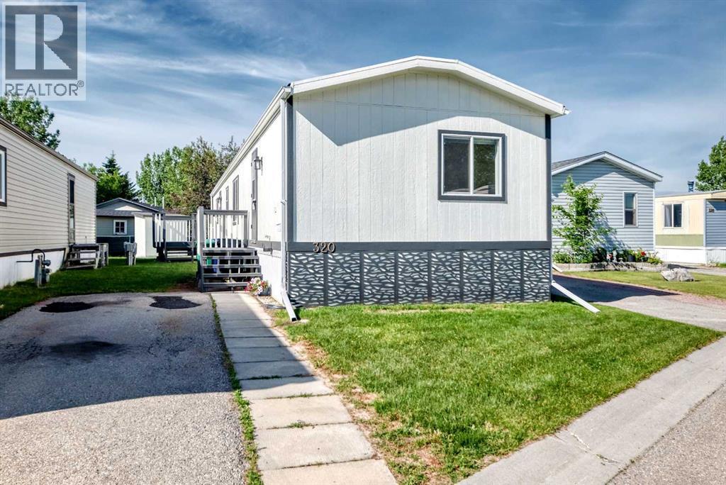 320, 1101 84 Street Ne, Calgary, Alberta  T2A 7X2 - Photo 1 - A2323372