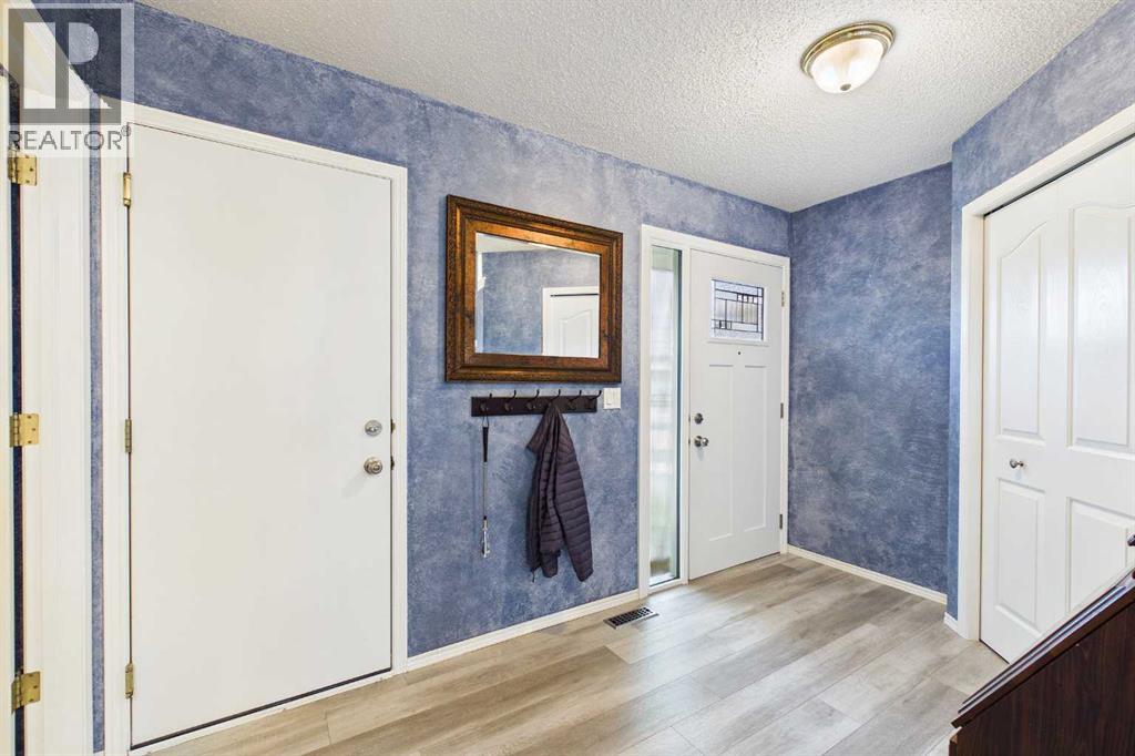 225 Bridlewood Court SW, Calgary, Alberta  T2Y 3Z2 - Photo 3 - A2323883