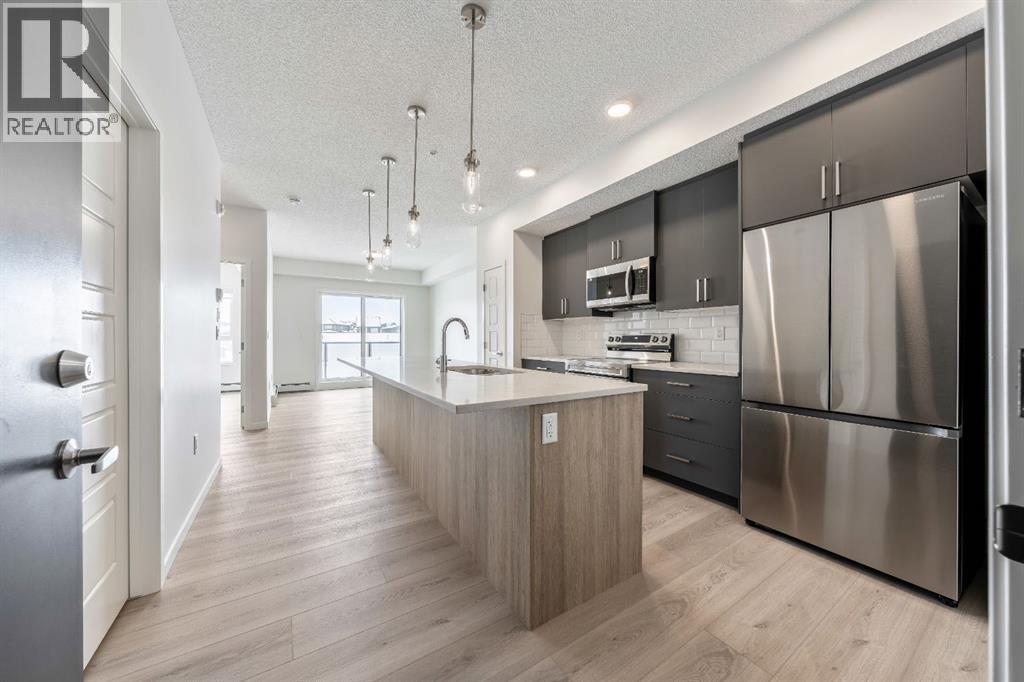 419, 245 Edith Place NW, Calgary, Alberta  T3R 2M7 - Photo 1 - A2299502