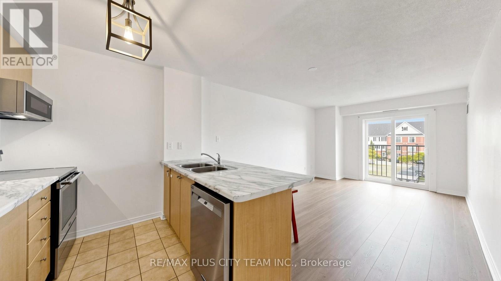201 - 94 Aspen Springs Drive, Clarington, Ontario  L1C 5N4 - Photo 6 - E13526456