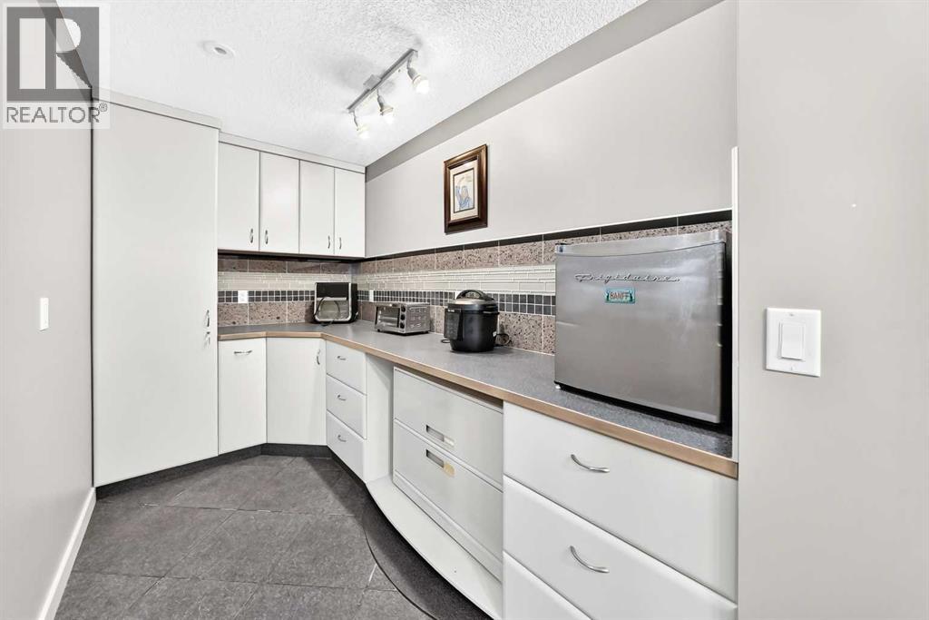 423 Rocky Ridge Drive NW, Calgary, Alberta  T3G 5C2 - Photo 41 - A2323190