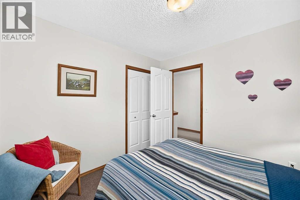 7919 Cougar Ridge Avenue SW, Calgary, Alberta  T3H 5L4 - Photo 37 - A2326820