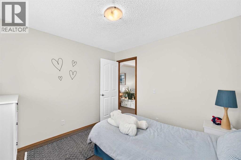 7919 Cougar Ridge Avenue SW, Calgary, Alberta  T3H 5L4 - Photo 35 - A2326820