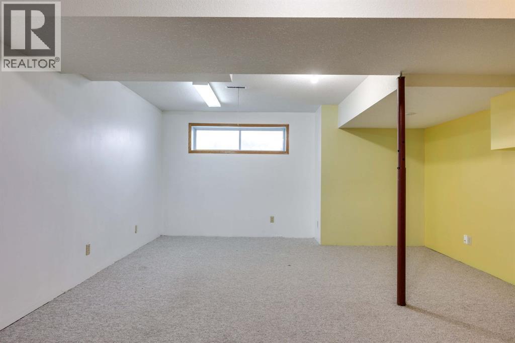 23 Sandalwood Close NW, Calgary, Alberta  T3K 4B4 - Photo 21 - A2327987