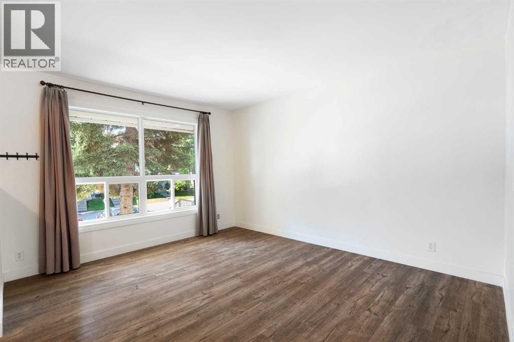 191 Woodmont Terrace SW, Calgary, Alberta  T2W 3K3 - Photo 5 - A2321912