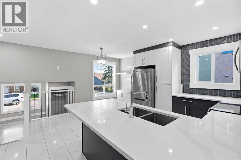 99 Pinecliff Close, Calgary, Alberta  T1Y 4N4 - Photo 7 - A2329433