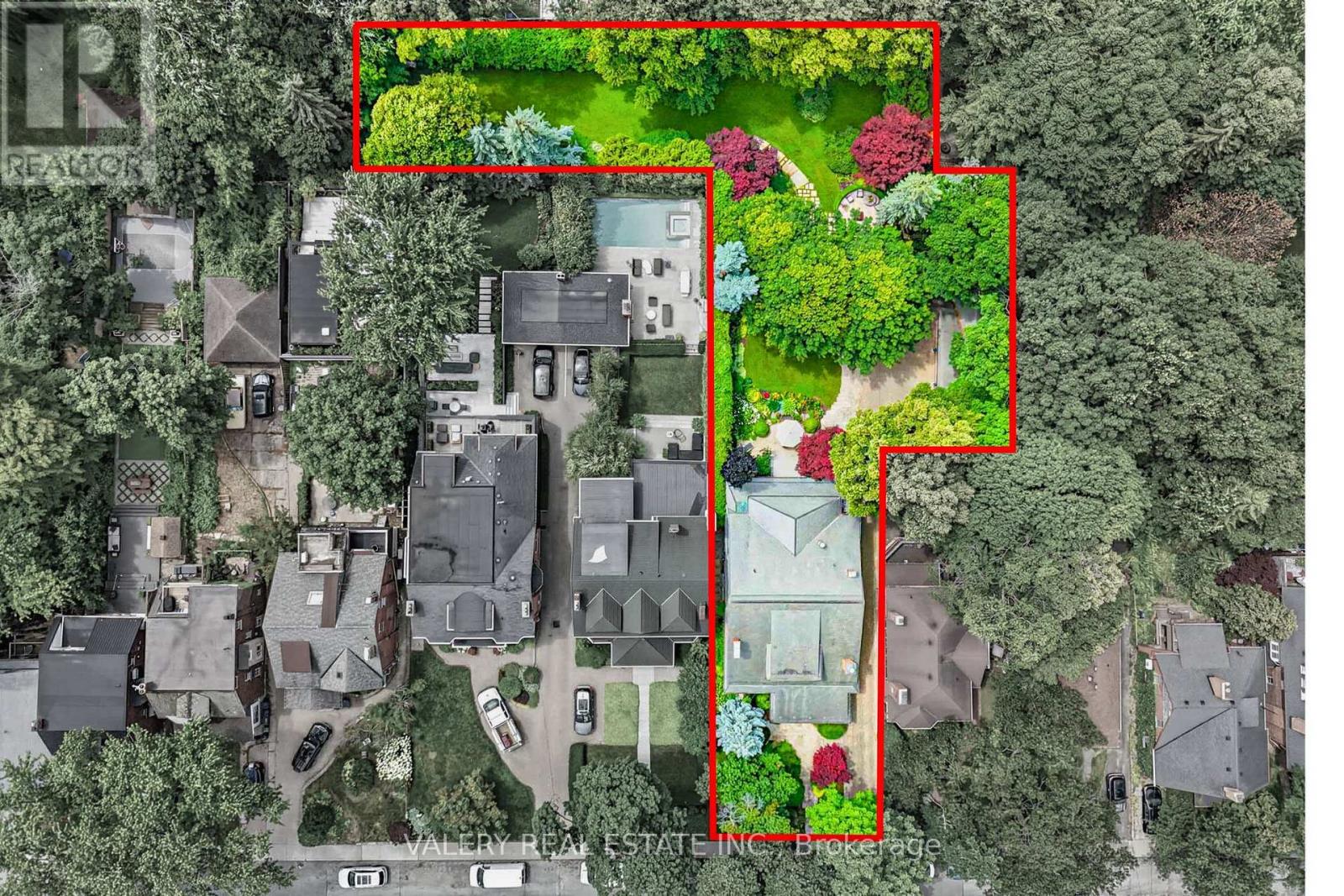 Is this the largest residential lot in High Park? Welcome home to 270 Indian Road, an exceptional estate property set on an extraordinary 0.56-acre (24,000 sq. ft.) L-shaped lot in one of Toronto's most sought-after neighbourhoods. The home offers 4 Bedrooms, 7 Bathrooms and 5,968 sq. ft. of living space. Originally built in 1924 for William G. Harris, founder of Canada Metal Co., and designed by the esteemed F.S. Mallory. The exterior boasts a timeless slate roof, copper downspouts, decorative patterned glass, and distinctive brick chimneys, culminating in an iconic façade that embodies enduring elegance and architectural distinction. A comprehensive, no-expense-spared renovation of the highest calibre was completed preserving the home's character while elevating it for modern living. Step inside where a grand reception hall welcomes you with handcrafted millwork, a soaring barrel-vaulted ceiling and quarter sawn oak floors throughout all levels. An exquisite chef's kitchen with bespoke cabinetry, an oversized center island, and an inviting family room overlooking the estate grounds. A collection of elegant rooms including a richly paneled formal dining room, sophisticated living room, distinguished library, executive office and designer powder room. On the upper floor the serene primary bedroom offers two ensuite bathrooms and two luxurious walk-in closets for the ultimate comfort. The additional three bedrooms are generously sized, each complete with their own private ensuite. The lower level is designed as an extension of the home's living space, featuring 8-foot ceilings, a games area, hobby room, wine cellar and a private guest suite with a full bathroom. The backyard is a private garden estate with mature trees, an art studio, a 3-bay heated garage that doubles as an entertainment lounge complete with a bar, projector and nightclub lighting. The backyard offers remarkable privacy, truly a property that must be seen to be believed. Furniture Negotiable. (id:48254)
