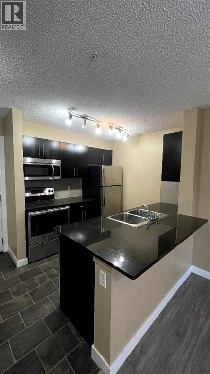 6210, 403 Mackenzie Way SW, Airdrie, Alberta T4B 3V7 - Photo 9 - A2329371