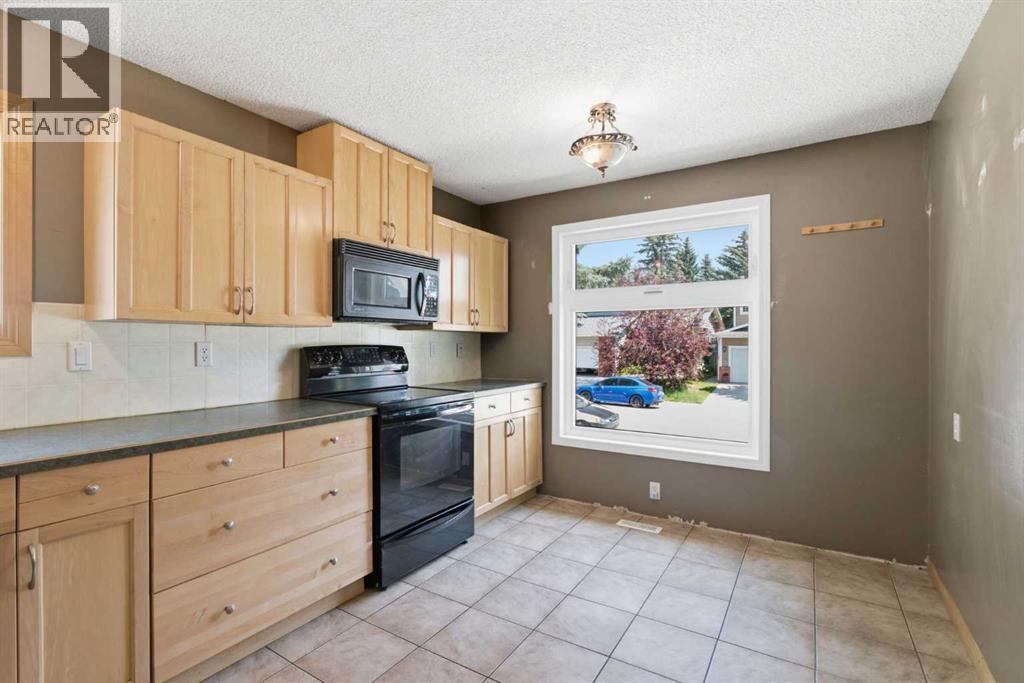 39 Woodglen Way Sw, Calgary, Alberta  T2W 4W8 - Photo 10 - A2328228