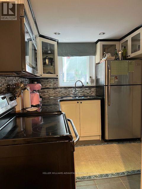 823 Craven Road, Toronto, Ontario  M4L 2Z7 - Photo 3 - E13589796